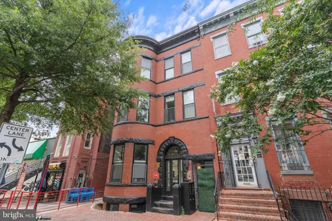 a front view of a multi story residential apartment buildings