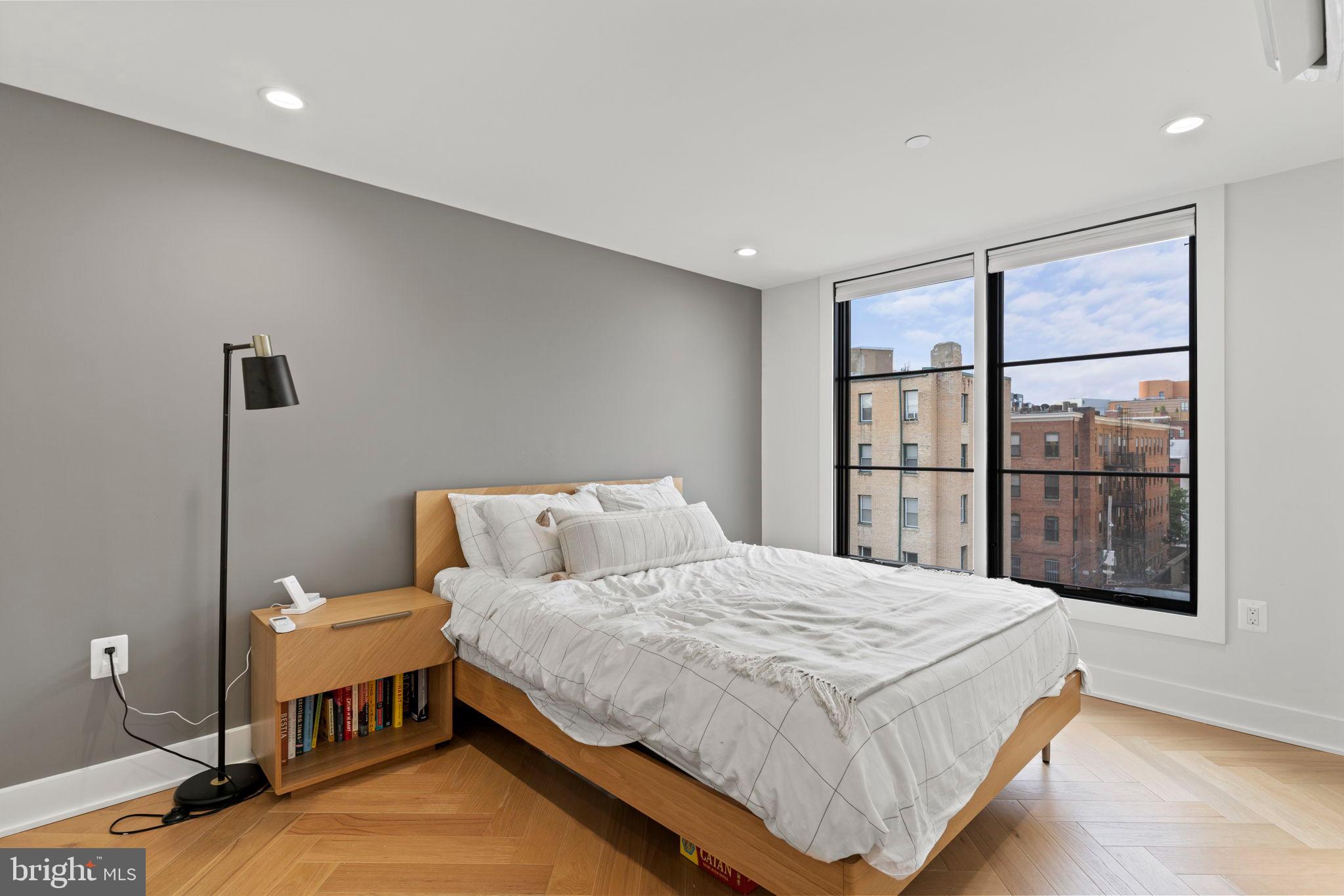 1225 11th Street Northwest, Unit 9 Washington, DC 20001 - Photo 13 of 20 a bedroom with a bed and a window