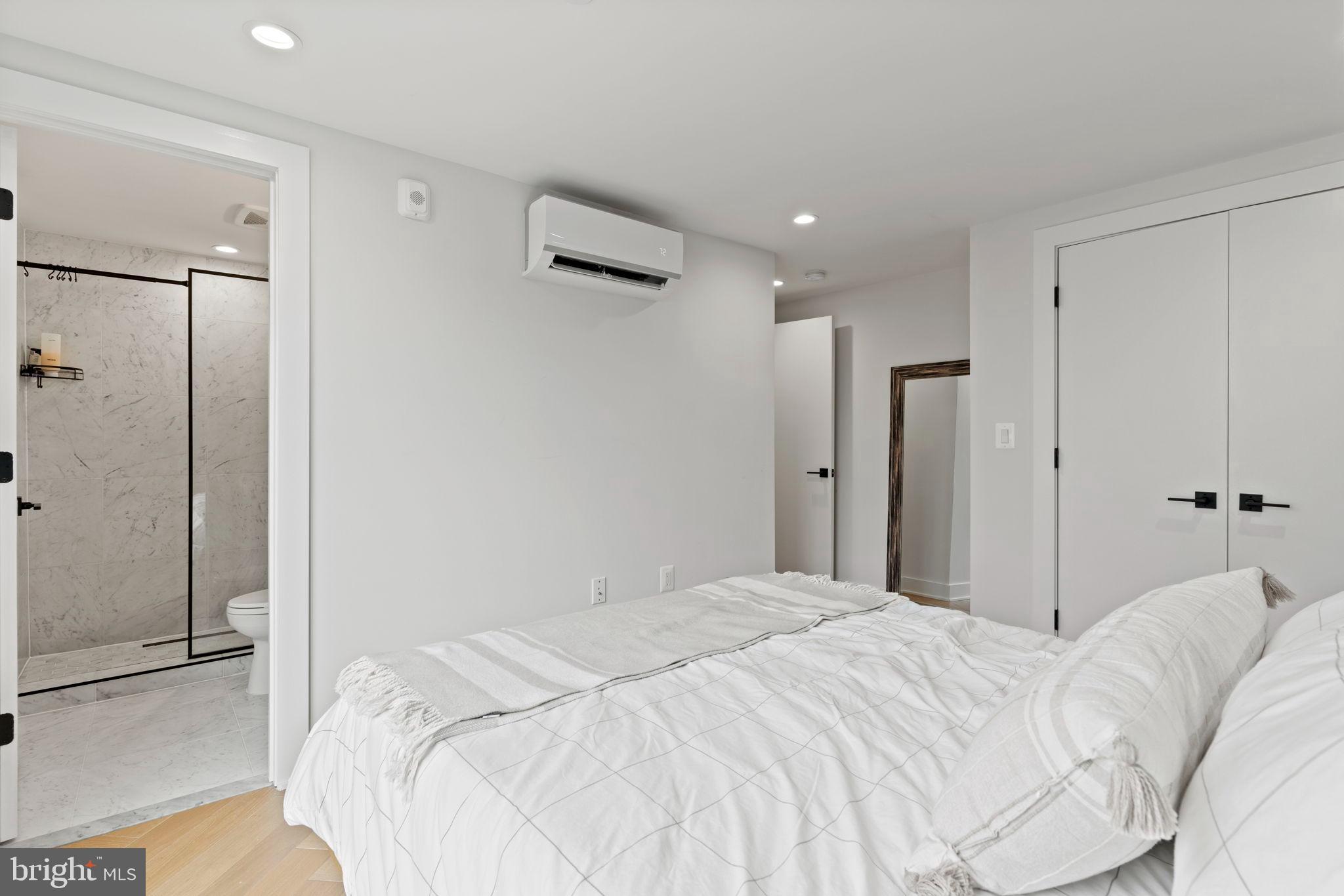 1225 11th Street Northwest, Unit 9 Washington, DC 20001 - Photo 15 of 20 a bedroom with a bed and a walk in closet