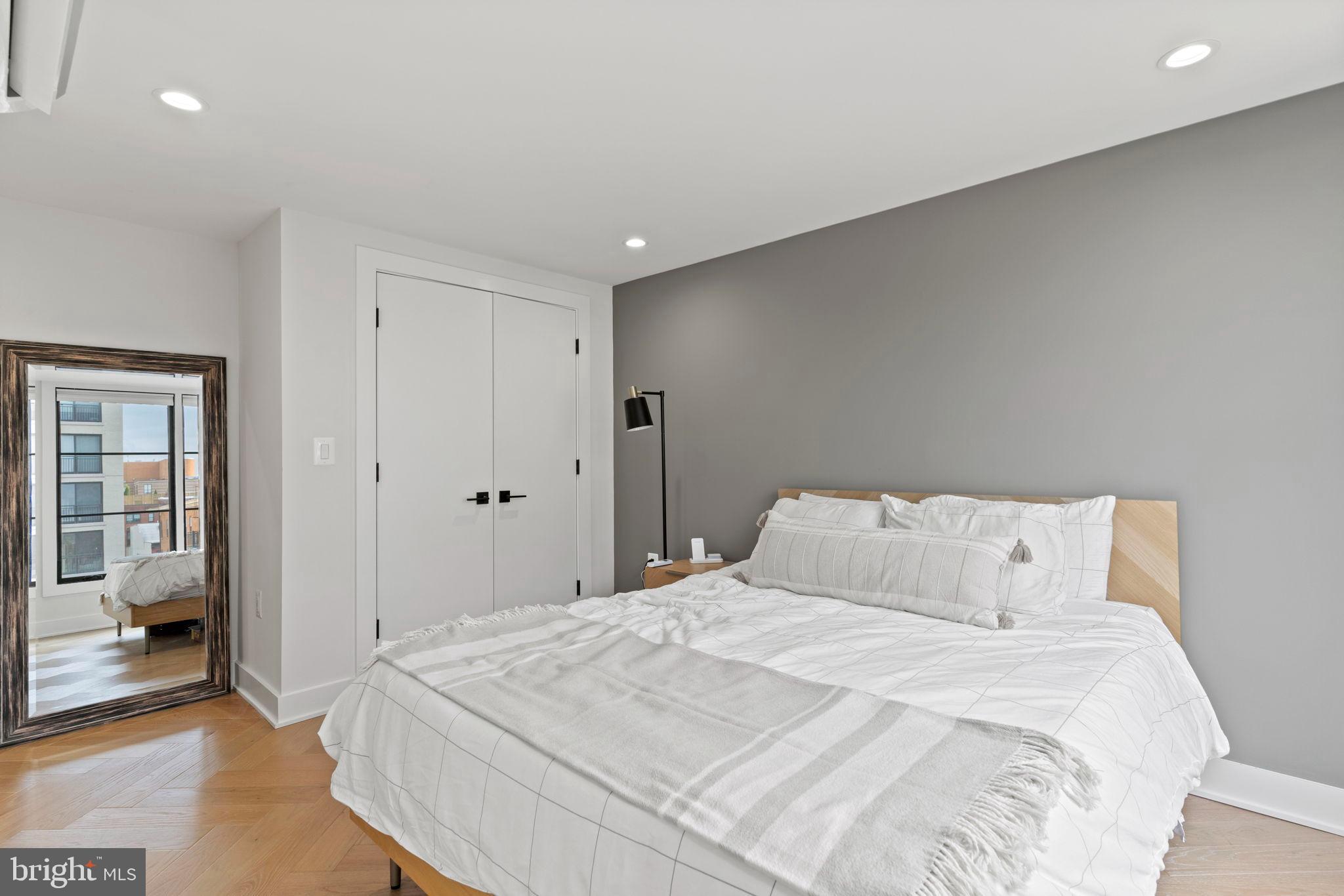 1225 11th Street Northwest, Unit 9 Washington, DC 20001 - Photo 16 of 20 a bedroom with a bed and a walk in closet