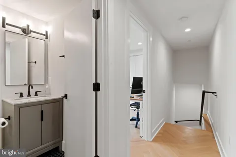 a bathroom with a sink and mirror