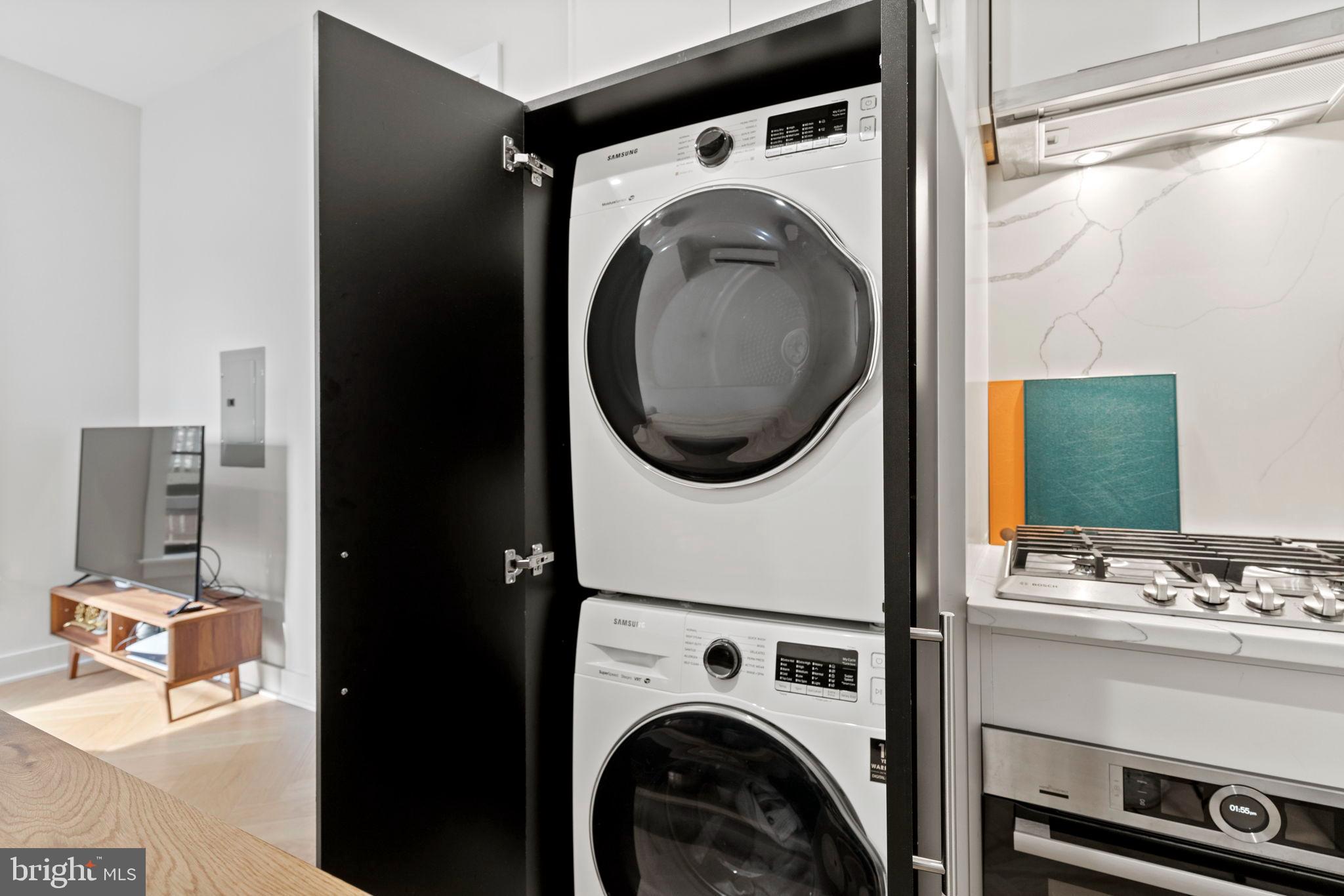 1225 11th Street Northwest, Unit 9 Washington, DC 20001 - Photo 19 of 20 a utility room with dryer washer and a view of living room
