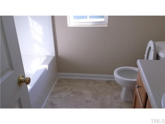 5417 Glass Ridge Road Raleigh, NC 27616 - Photo 12 of 14 a bathroom with a sink and a toilet