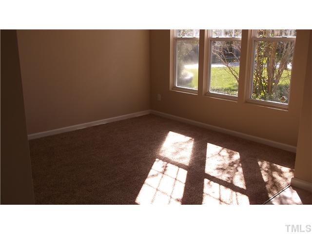 5417 Glass Ridge Road Raleigh, NC 27616 - Photo 5 of 14 a open hall with a window