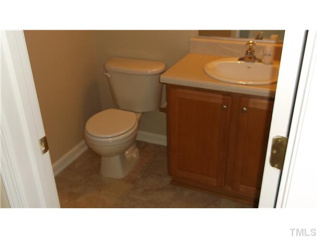 5417 Glass Ridge Road Raleigh, NC 27616 - Photo 6 of 14 a bathroom with a sink and a toilet