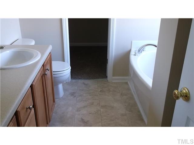 5417 Glass Ridge Road Raleigh, NC 27616 - Photo 8 of 14 a bathroom with a sink and toilet