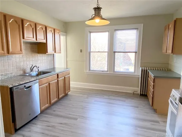 a view of a kitchen cabinets and wooden floor