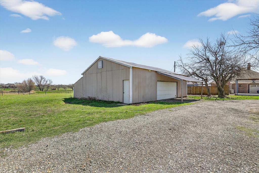 131 Hawk Ridge Decatur, TX 76234 - Photo 18 of 34 Detached garage with driveway