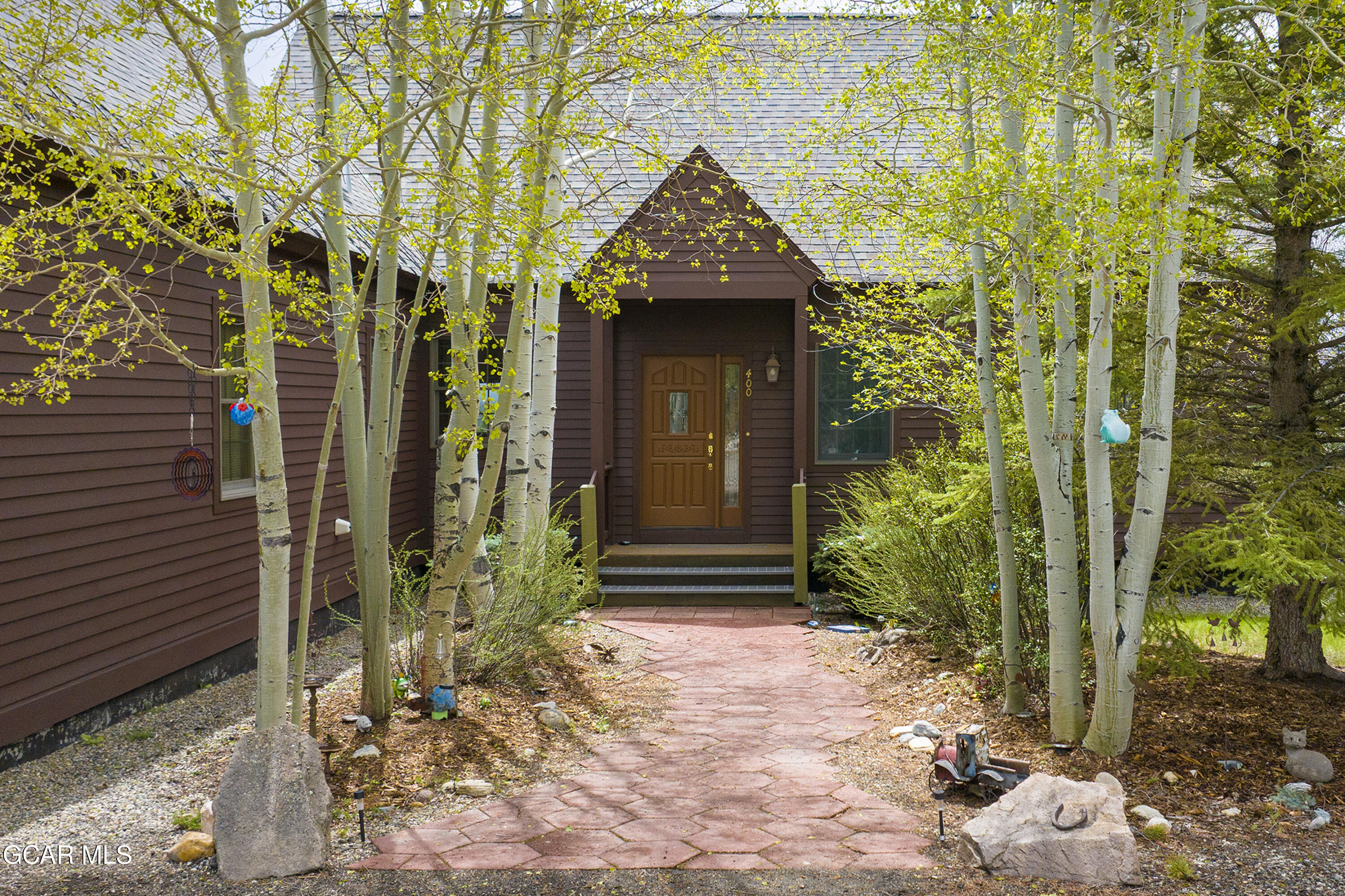 400 Ridge Road Tabernash, CO 80478 - Photo 4 of 50 a front view of a house with a yard