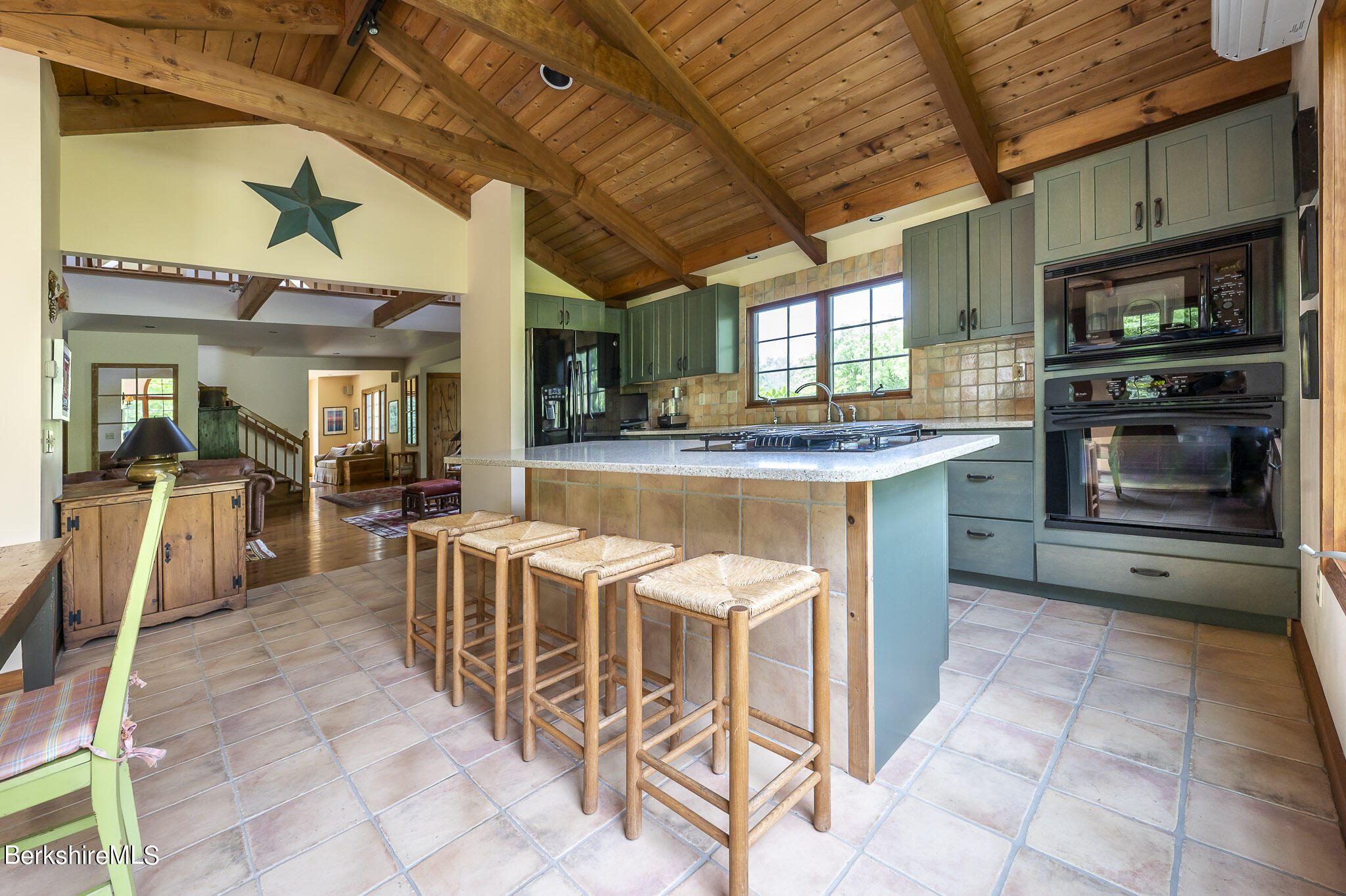47 E Road Alford, MA 01266 - Photo 16 of 46 a open kitchen with stainless steel appliances granite countertop a stove and a refrigerator