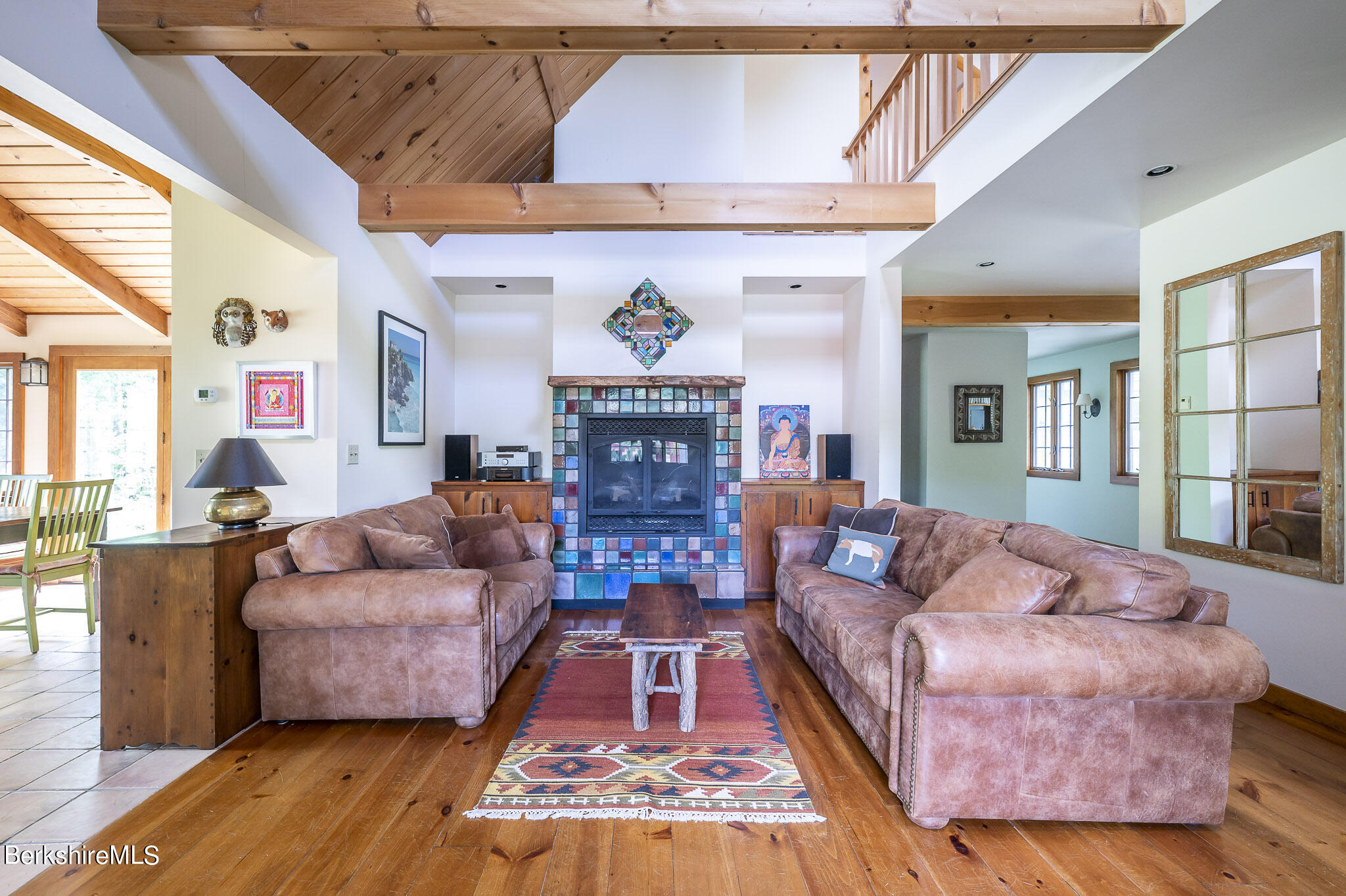 47 E Road Alford, MA 01266 - Photo 19 of 46 a living room with fireplace furniture and a wooden floor