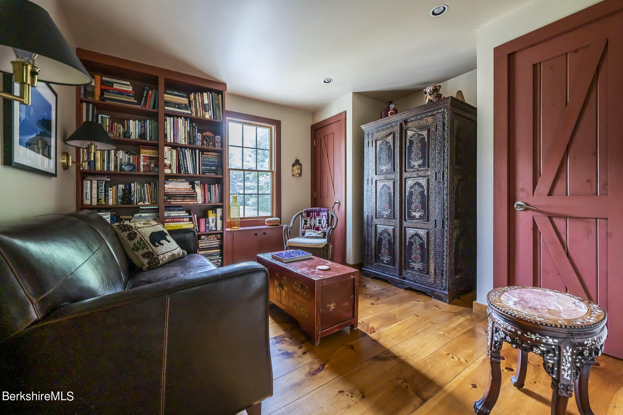 47 E Road Alford, MA 01266 - Photo 21 of 46 a living room with furniture a piano and a bookshelf