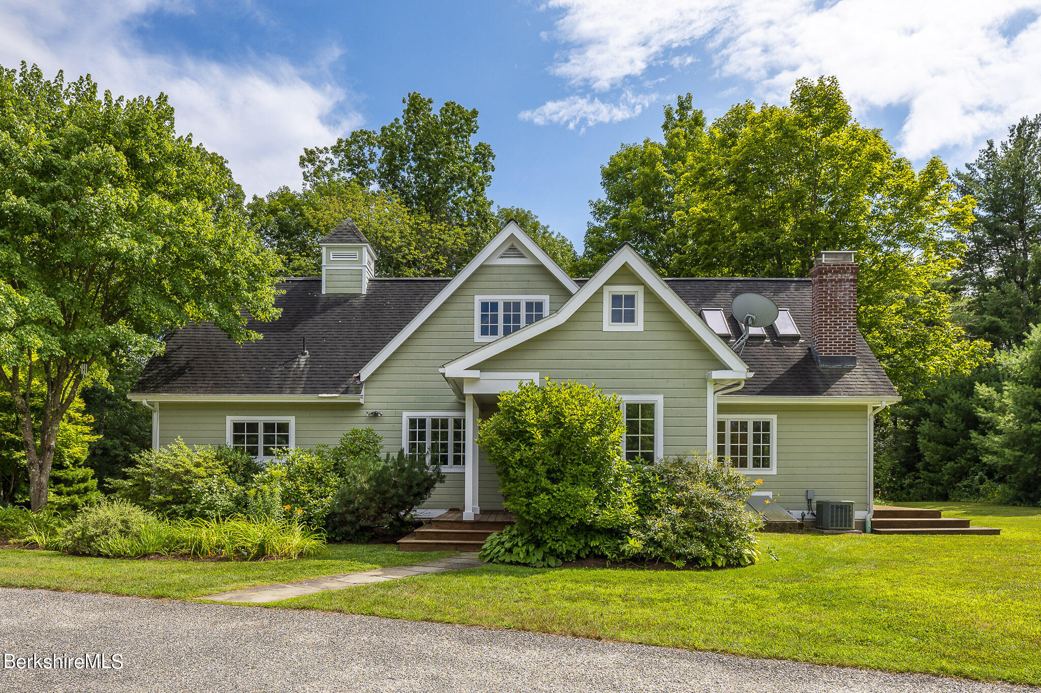 47 E Road Alford, MA 01266 - Photo 3 of 46 a front view of a house with a yard and potted plants