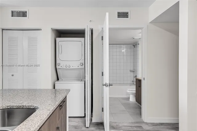 a kitchen with a refrigerator and countertop