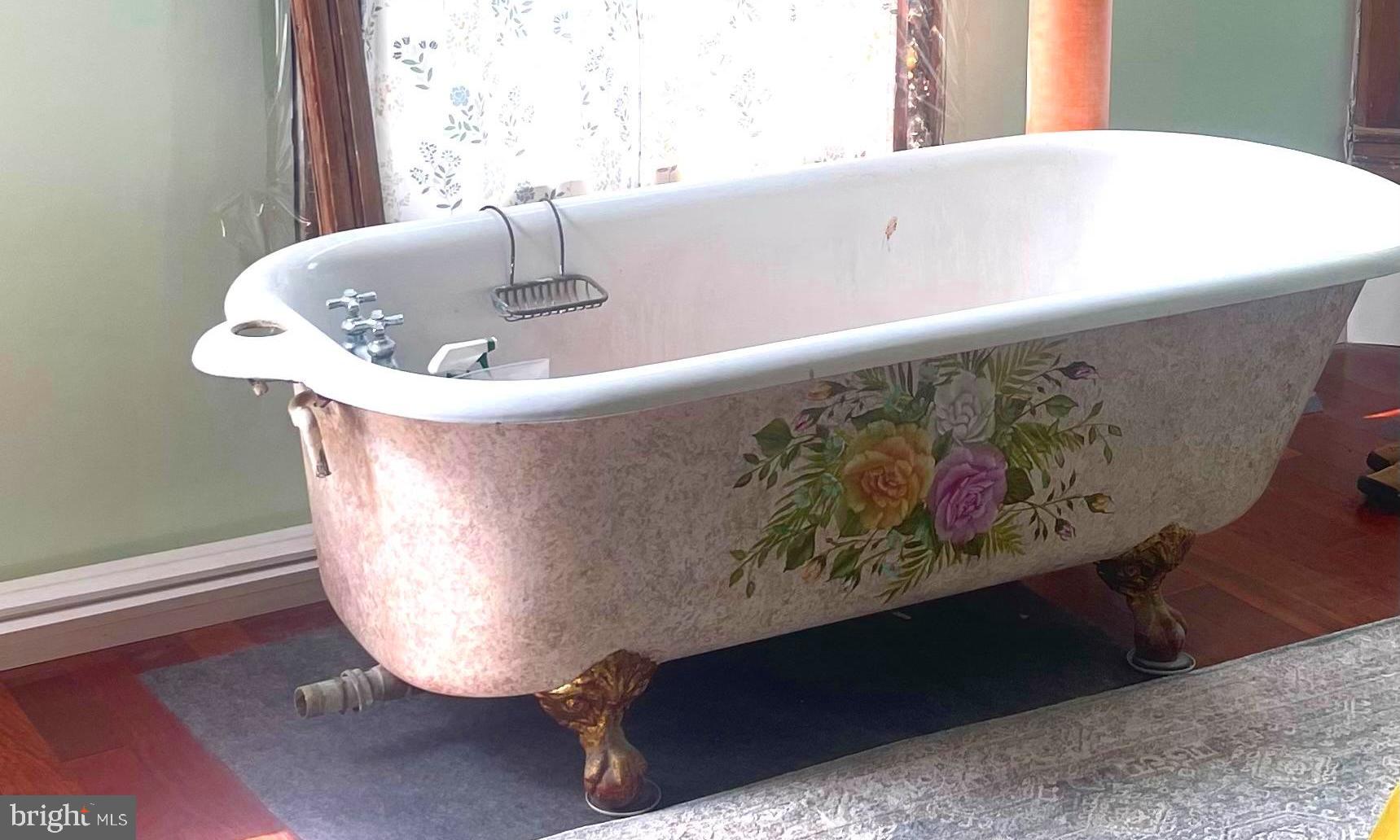 6310 St Leonard Road St. Leonard, MD 20685 - Photo 11 of 26 a white bath tub sitting in a bathroom