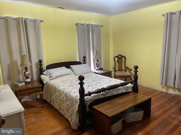 a view of living room with furniture and a fireplace