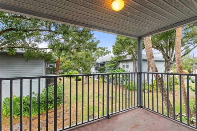 a view of balcony with wooden floor