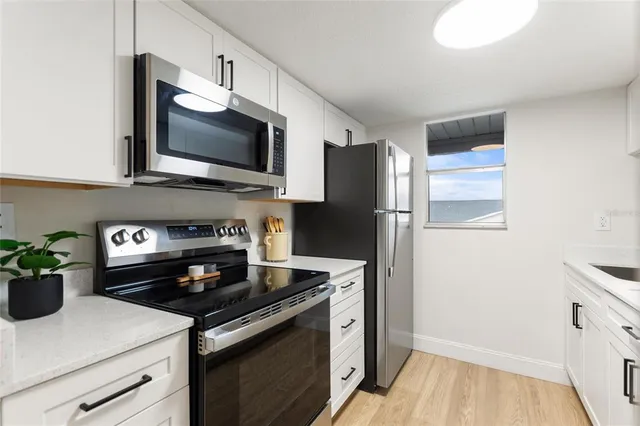 a kitchen with a stove and a microwave