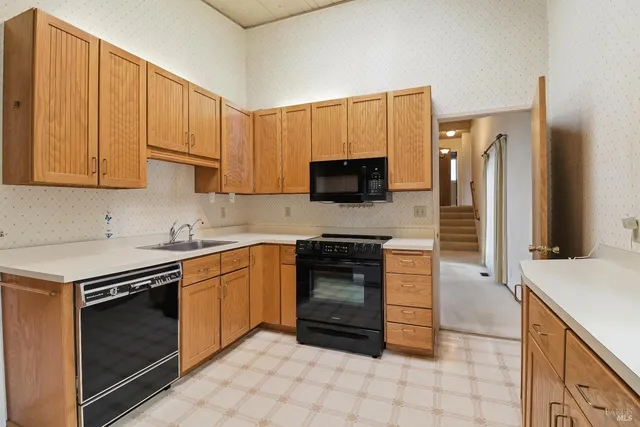 a white refrigerator freezer sitting in a kitchen