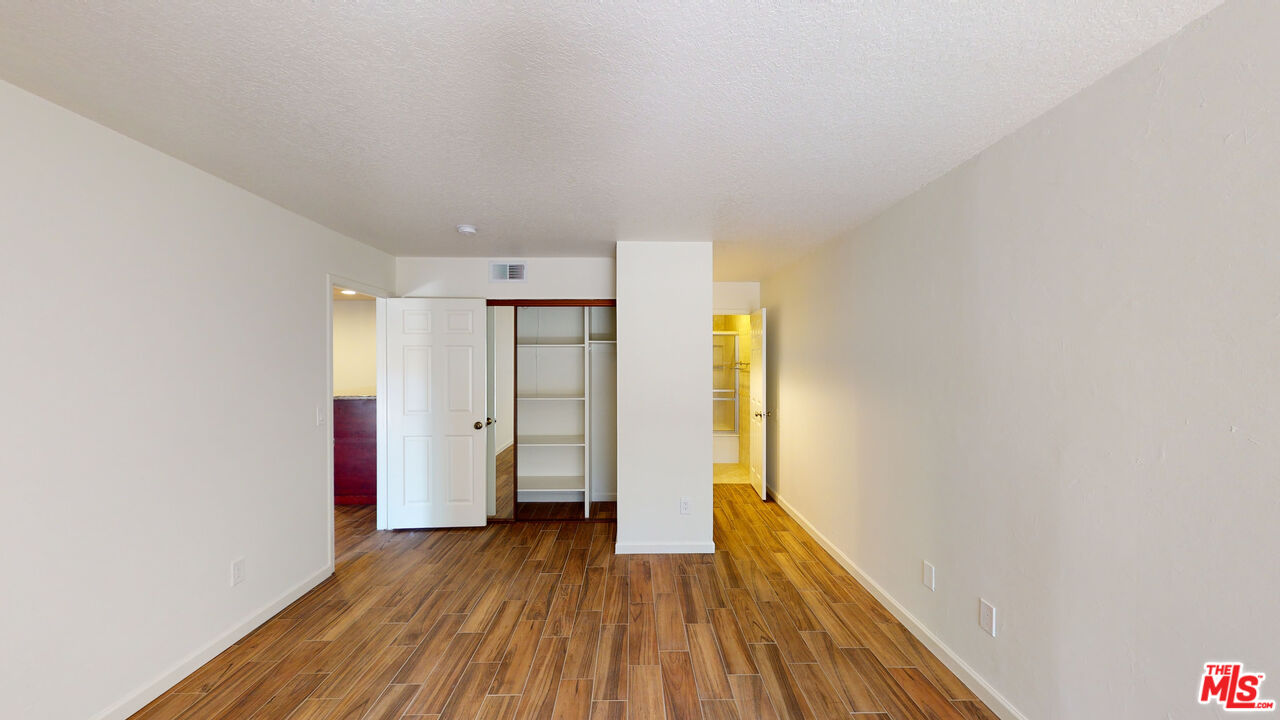 8600 Tuscany Avenue, Unit 202 Playa del Rey, CA 90293 - Photo 14 of 29 a view of a hallway with wooden floor