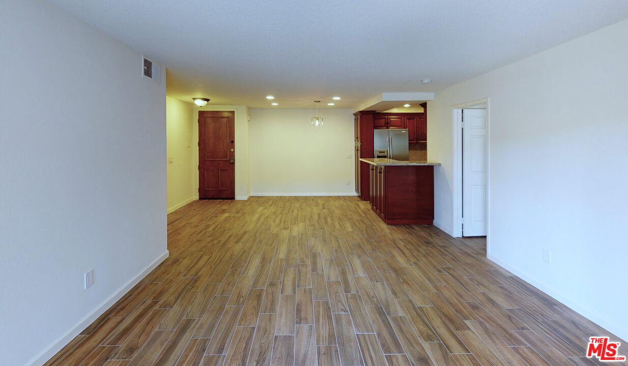 8600 Tuscany Avenue, Unit 202 Playa del Rey, CA 90293 - Photo 19 of 29 a view of a room with wooden floor and staircase