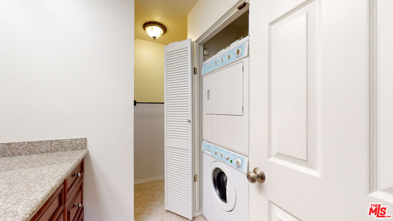 8600 Tuscany Avenue, Unit 202 Playa del Rey, CA 90293 - Photo 20 of 29 a utility room with dryer and washer
