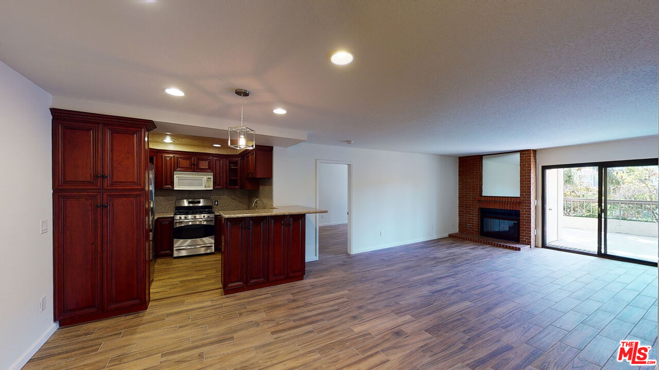 8600 Tuscany Avenue, Unit 202 Playa del Rey, CA 90293 - Photo 6 of 29 a view of a kitchen with a sink and a window