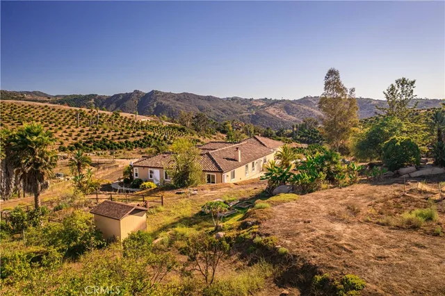 a view of yard with swimming pool and mountains