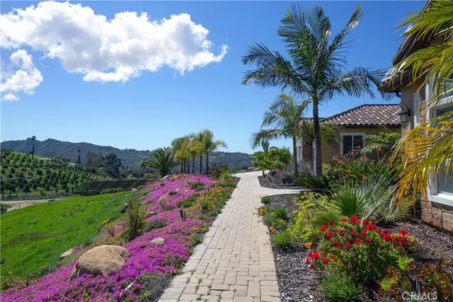 a group of people sitting in a yard