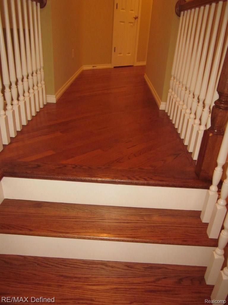 2670 Monarch Court Rochester, MI 48306 - Photo 32 of 36 Hardwood Floors on Staircase and Upper Level