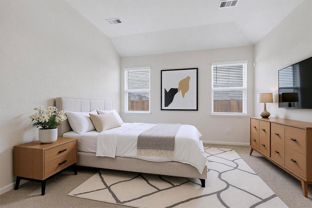 502 Monroe Jackson Street Venus, TX 76084 - Photo 19 of 40 a bedroom with a large bed and furniture