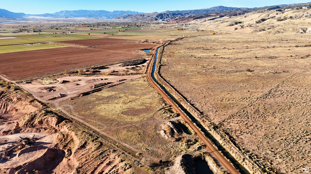 2600 Sevier Valley Canal Road Richfield, UT 84701 - Photo 16 of 63 Aerial view of property and surrounding area with rural landscape and a mountain backdrop