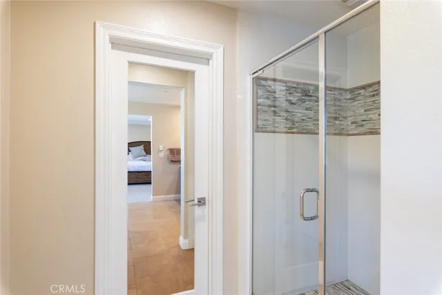 a bathroom with a shower and a sink