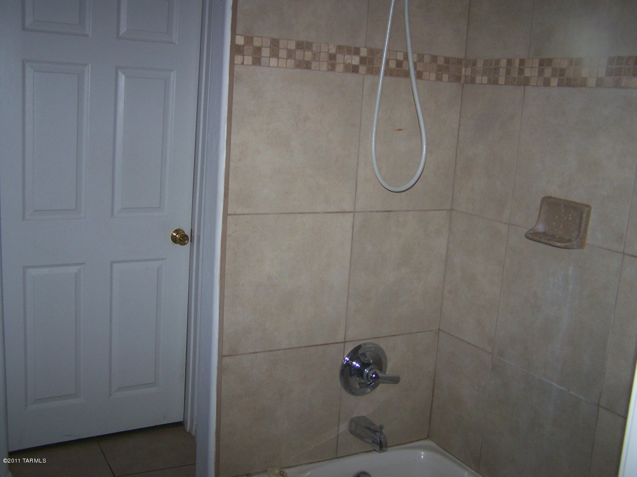 456 West Thurber Road Tucson, AZ 85705 - Photo 6 of 15 a bathroom with a glass shower door