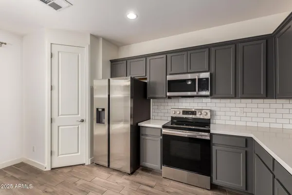 a bathroom with a sink a window and a mirror