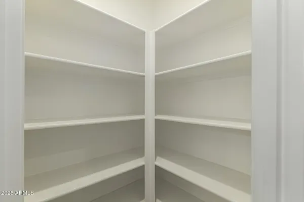 a view of a livingroom with a ceiling fan and window