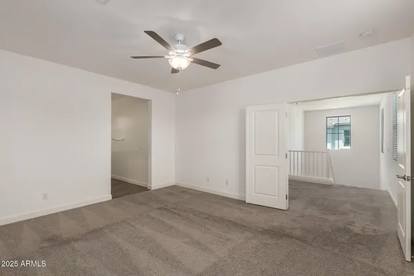 a bathroom with a granite countertop sink mirror and toilet
