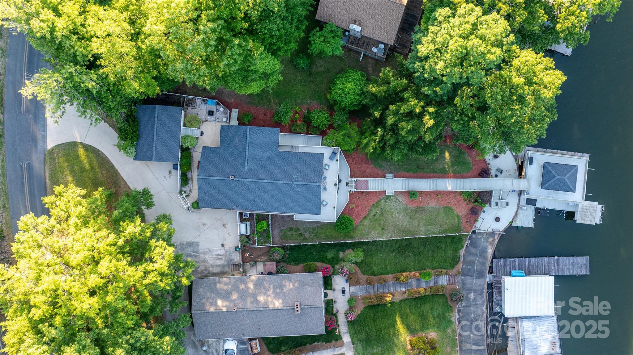 24264 Strand Drive Albemarle, NC 28001 - Photo 14 of 29 an aerial view of a house with a garden and trees