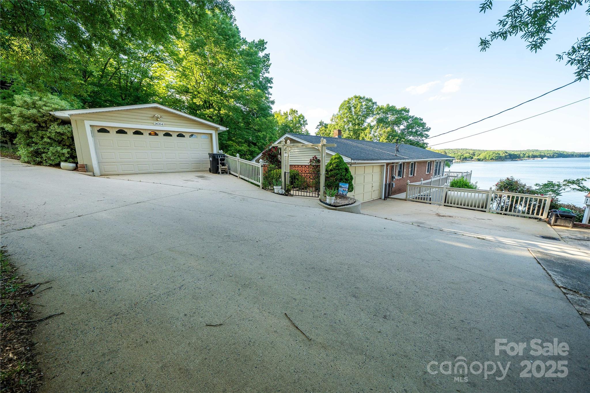 24264 Strand Drive Albemarle, NC 28001 - Photo 16 of 29 a front view of a house with a yard and garage