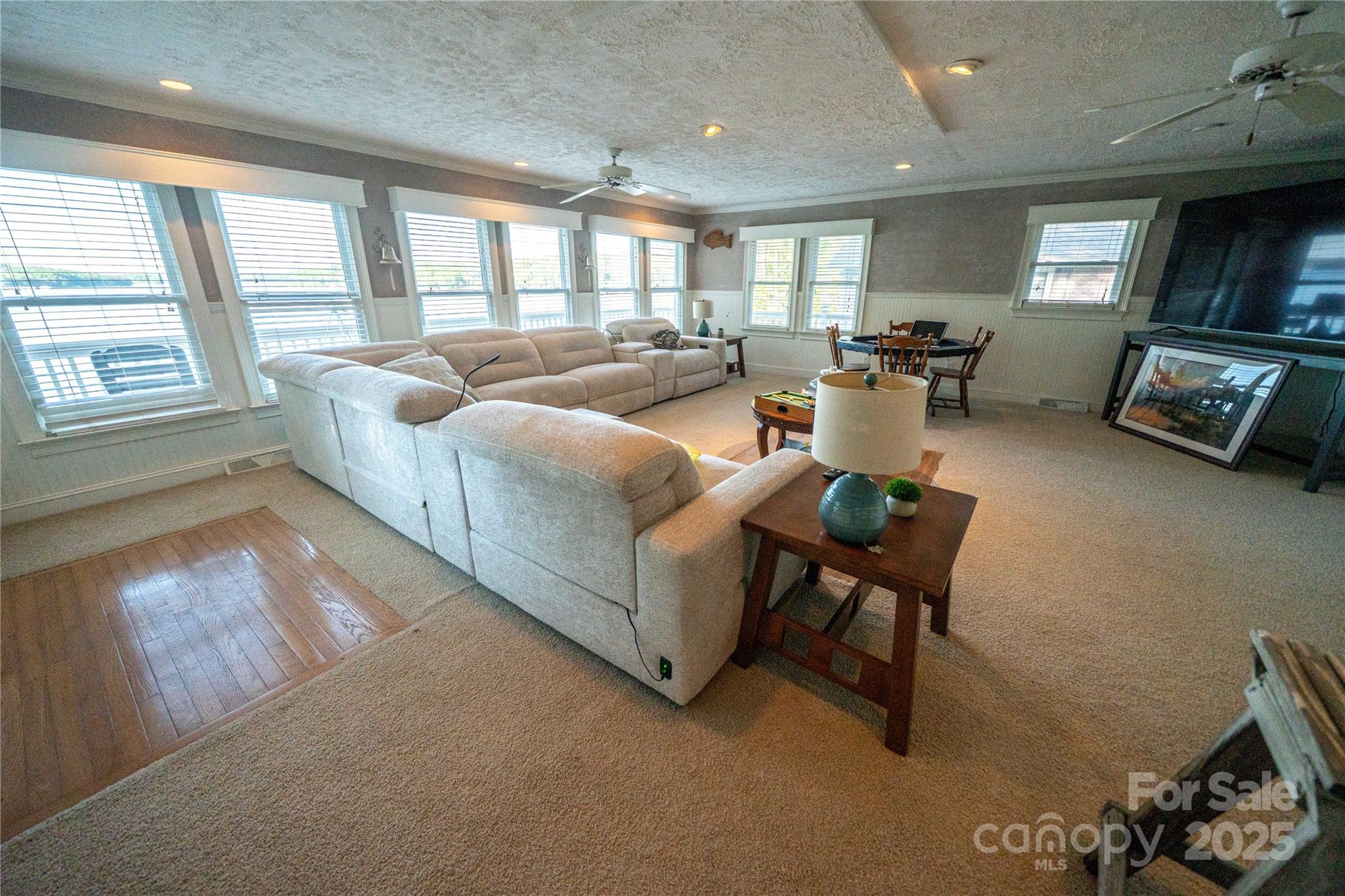 24264 Strand Drive Albemarle, NC 28001 - Photo 18 of 29 a living room with furniture and a flat screen tv