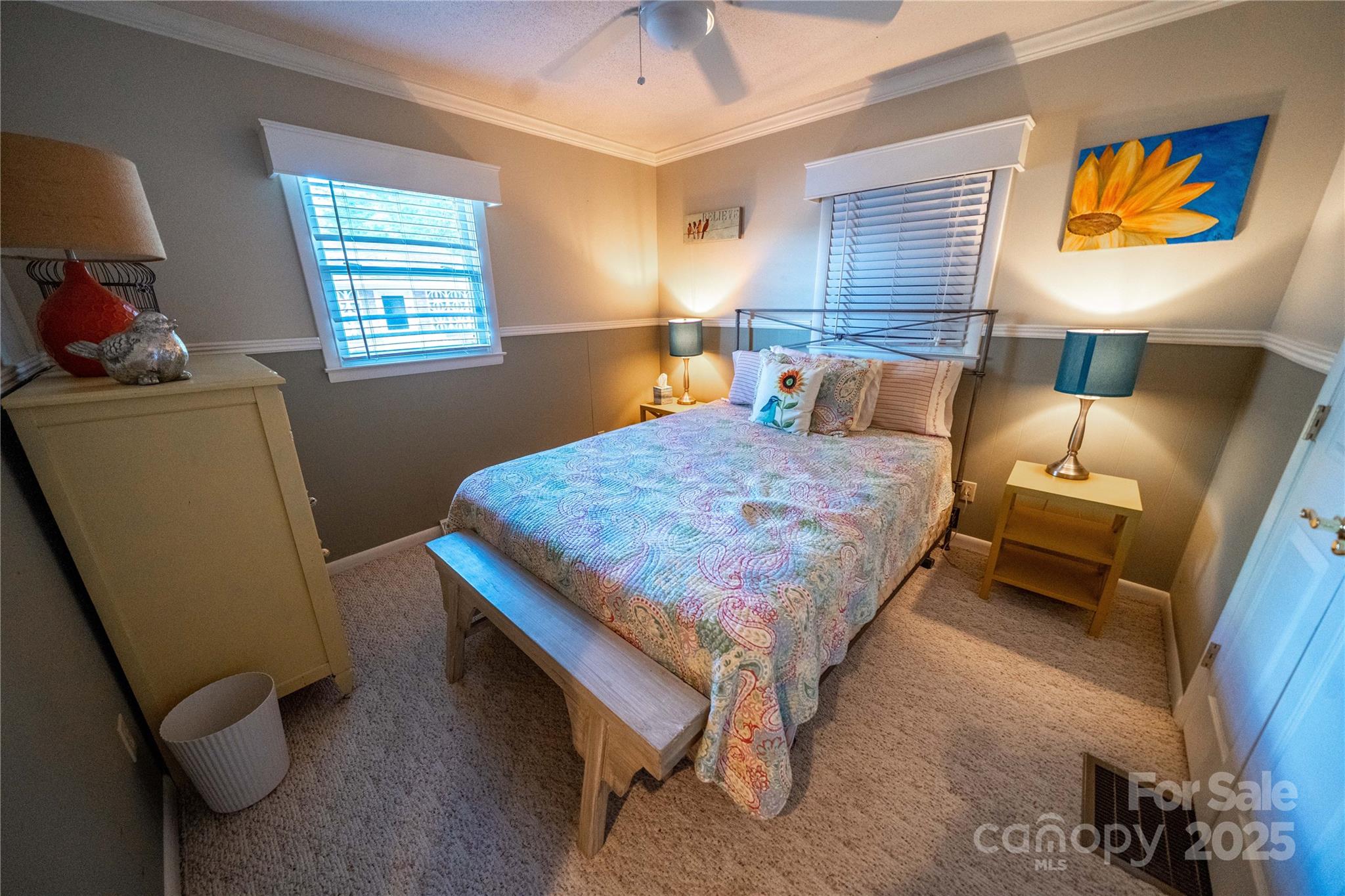 24264 Strand Drive Albemarle, NC 28001 - Photo 21 of 29 a bedroom with a bed and a dresser next to a window