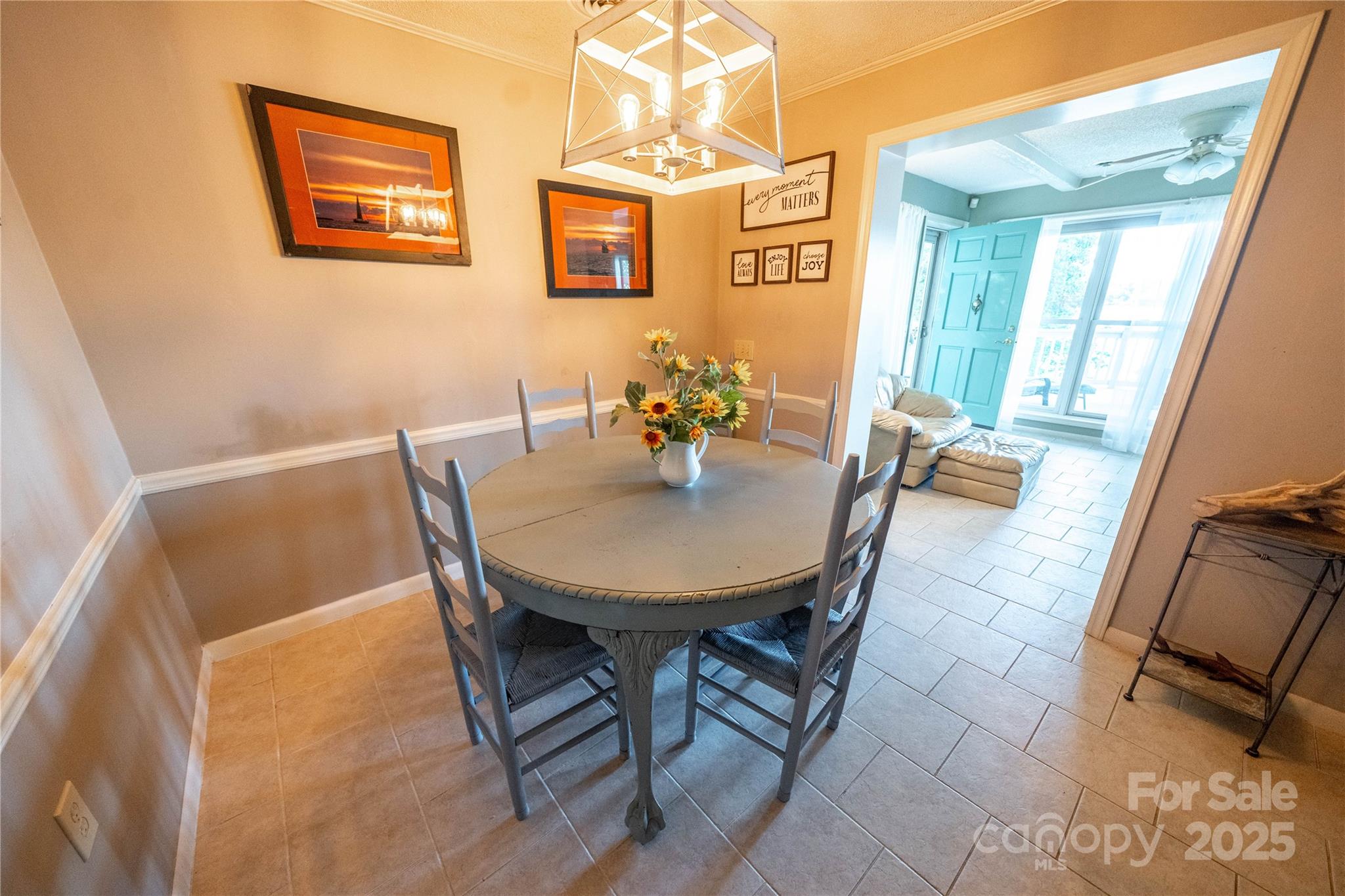 24264 Strand Drive Albemarle, NC 28001 - Photo 23 of 29 a view of a dining room with furniture and a chandelier