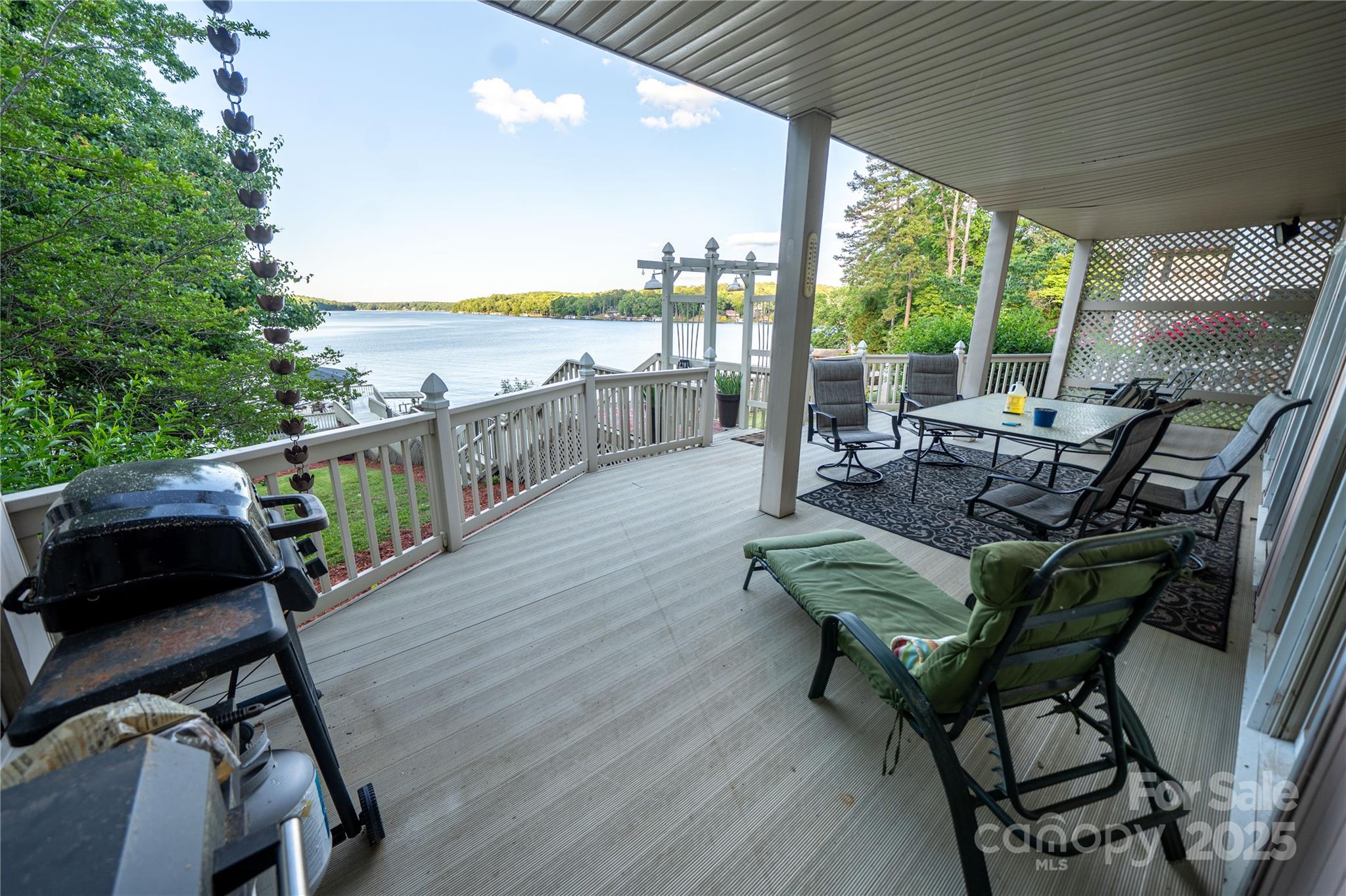 24264 Strand Drive Albemarle, NC 28001 - Photo 10 of 29 a view of a patio with lawn chairs next to a yard