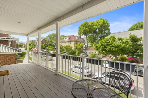 a view of balcony with furniture
