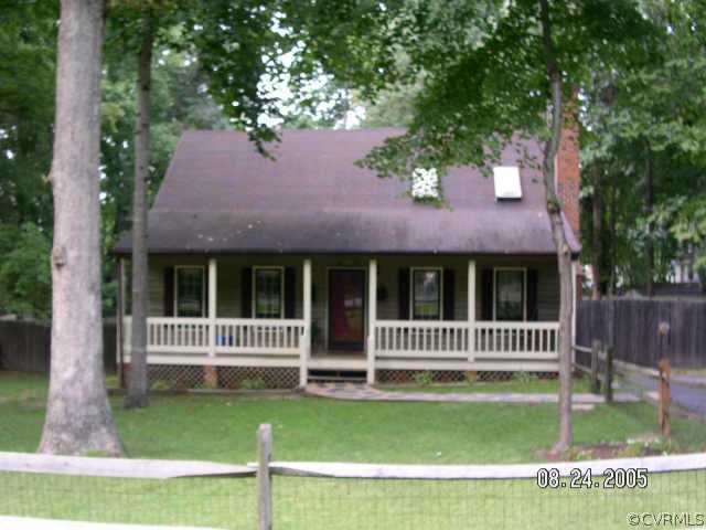 12106 Quito Road Midlothian, VA 23112 - Photo 1 of 1 a front view of a house with a garden