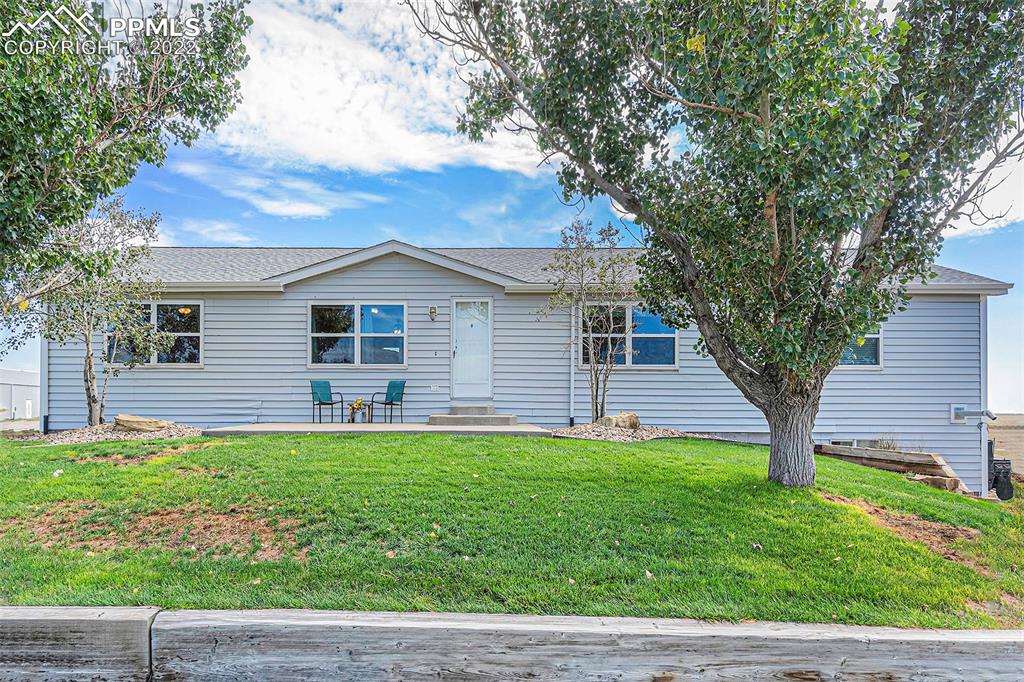 3180 Calhoun Byers Road Byers, CO 80103 - Photo 2 of 48 a house view with a garden space