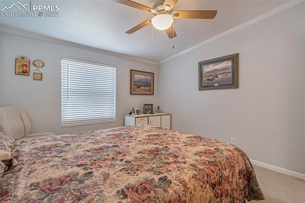 3180 Calhoun Byers Road Byers, CO 80103 - Photo 23 of 48 a bedroom with a large bed and a window