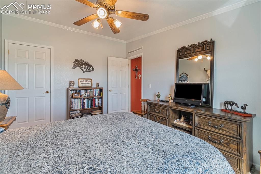 3180 Calhoun Byers Road Byers, CO 80103 - Photo 25 of 48 a view of a workspace with furniture and staircase
