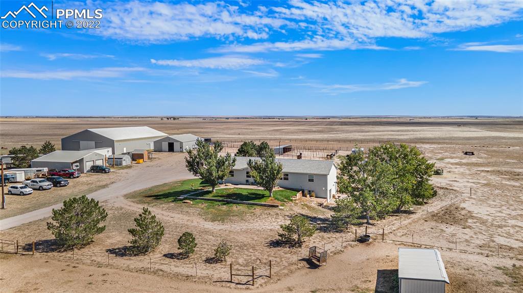 3180 Calhoun Byers Road Byers, CO 80103 - Photo 36 of 48 a view of a terrace with wooden floor and seating space