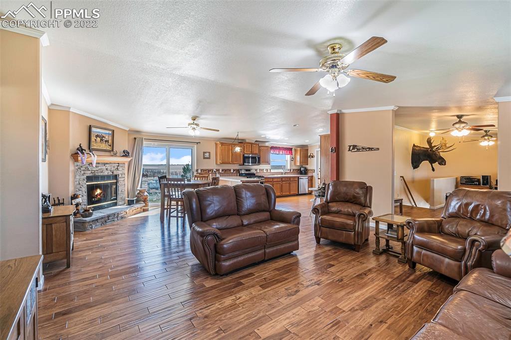 3180 Calhoun Byers Road Byers, CO 80103 - Photo 4 of 48 a living room with furniture and a fireplace